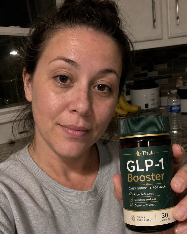 Thala customer holding a GLP-1 Booster bottle