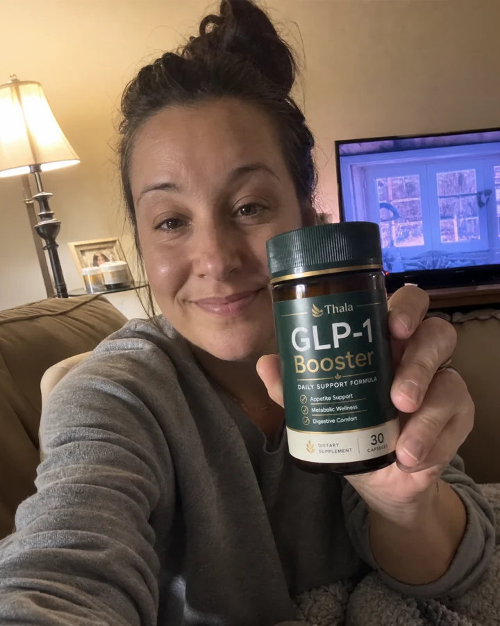 Thala customer holding a GLP-1 Booster bottle
